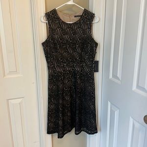 Black over nude cocktail dress